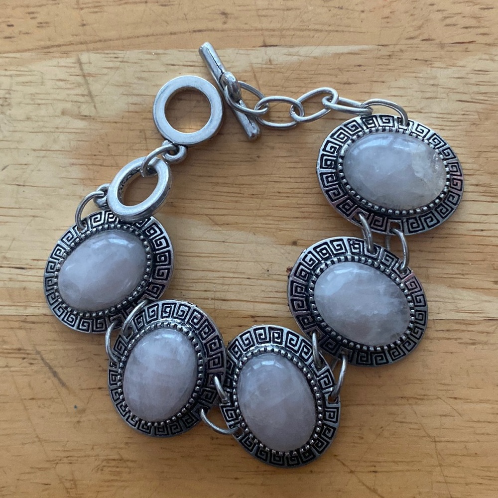 Silver tone and light pink stoned bracelet. slightly adjustable